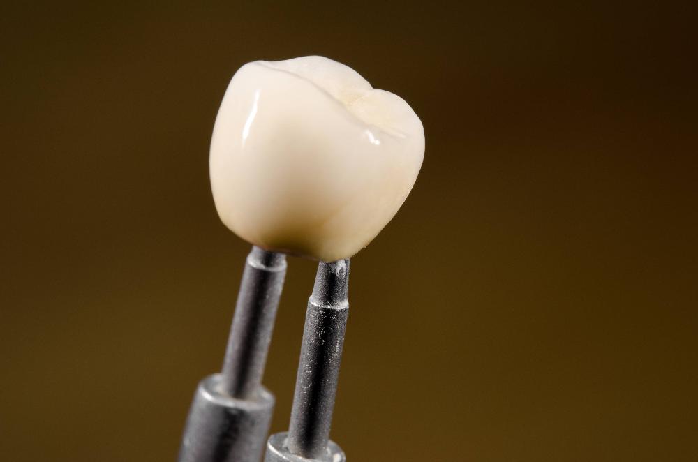 dental crown with dental tool | dental crown lakeville mn