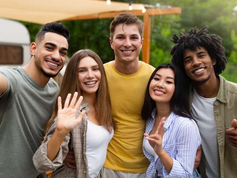 group of five friends hugging | dentist lakeville mn