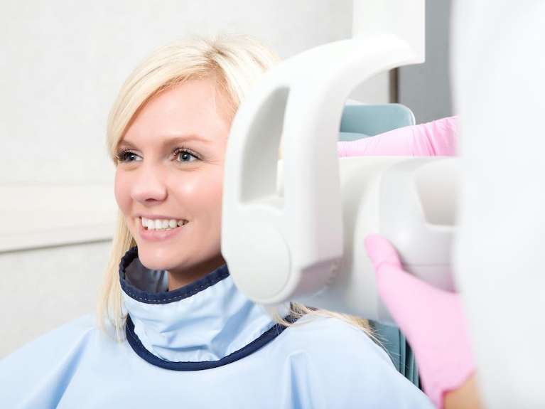 woman receiving dental x-ray | dentist lakeville mn
